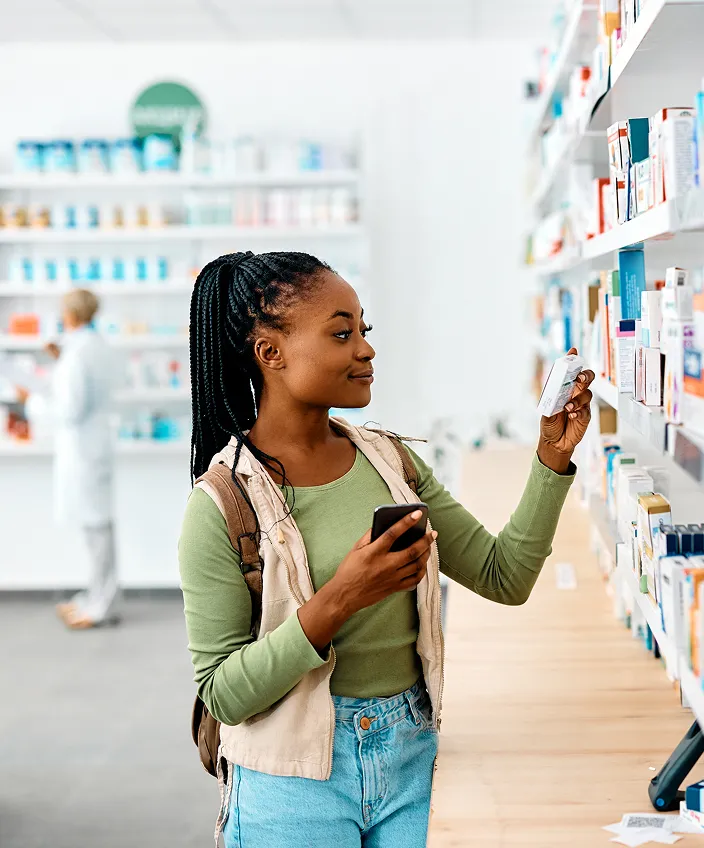 Patient browsing medications on a pharmacy shelf